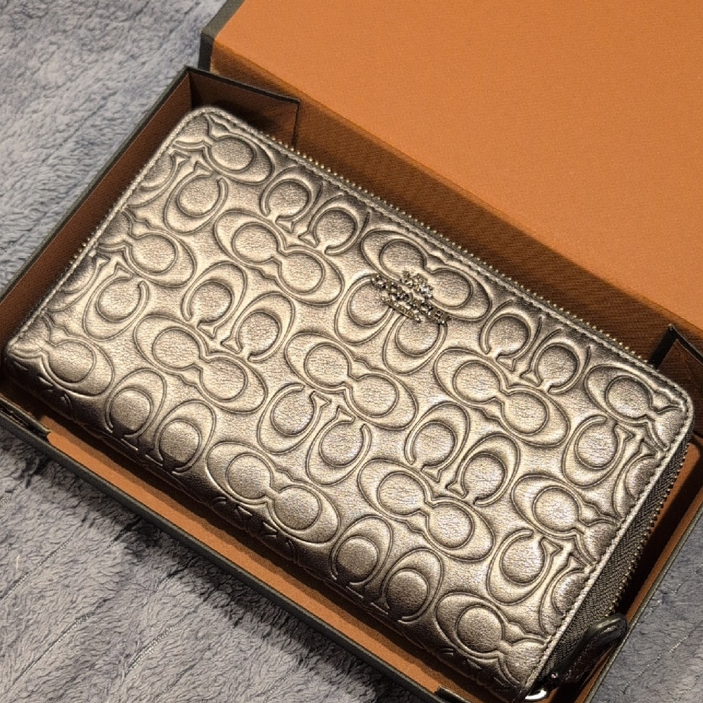 Coach Silver Embossed Zip Wallet